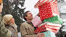 man holding presents