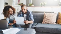 couple reviewing their travel insurance policy documents