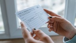 woman holding vaccine card