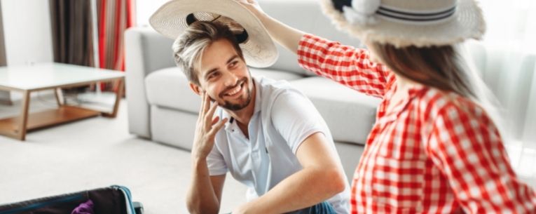 Allianz - couple packing for honeymoon