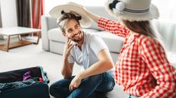 couple packing for honeymoon