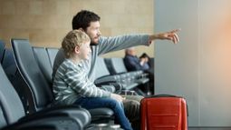 father and son in airport