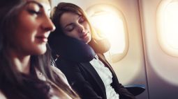 passenger sleeping on airplane